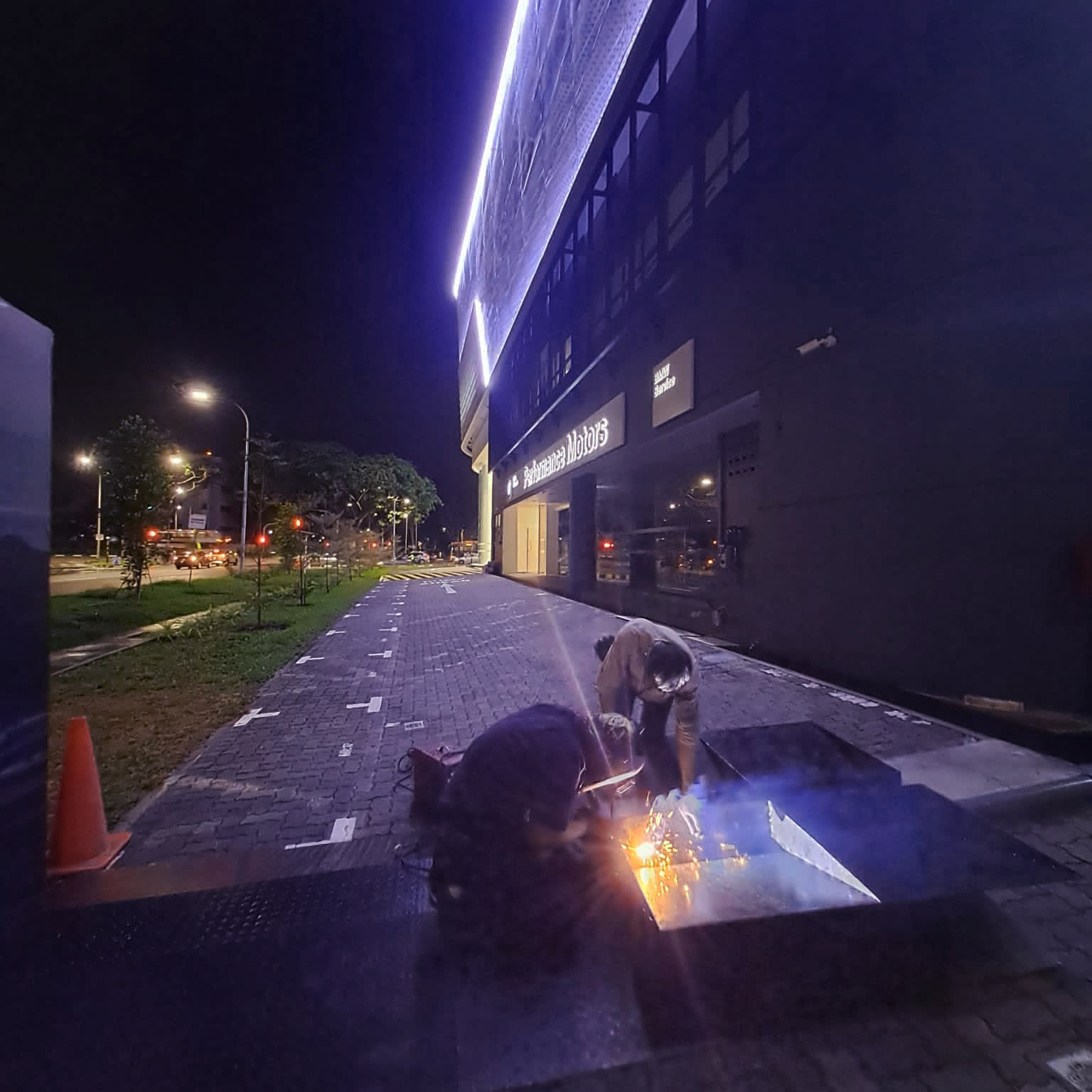 Two welders working onsite outdoors