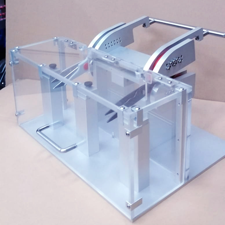 Device holding two pairs of scissors in an acrylic box
